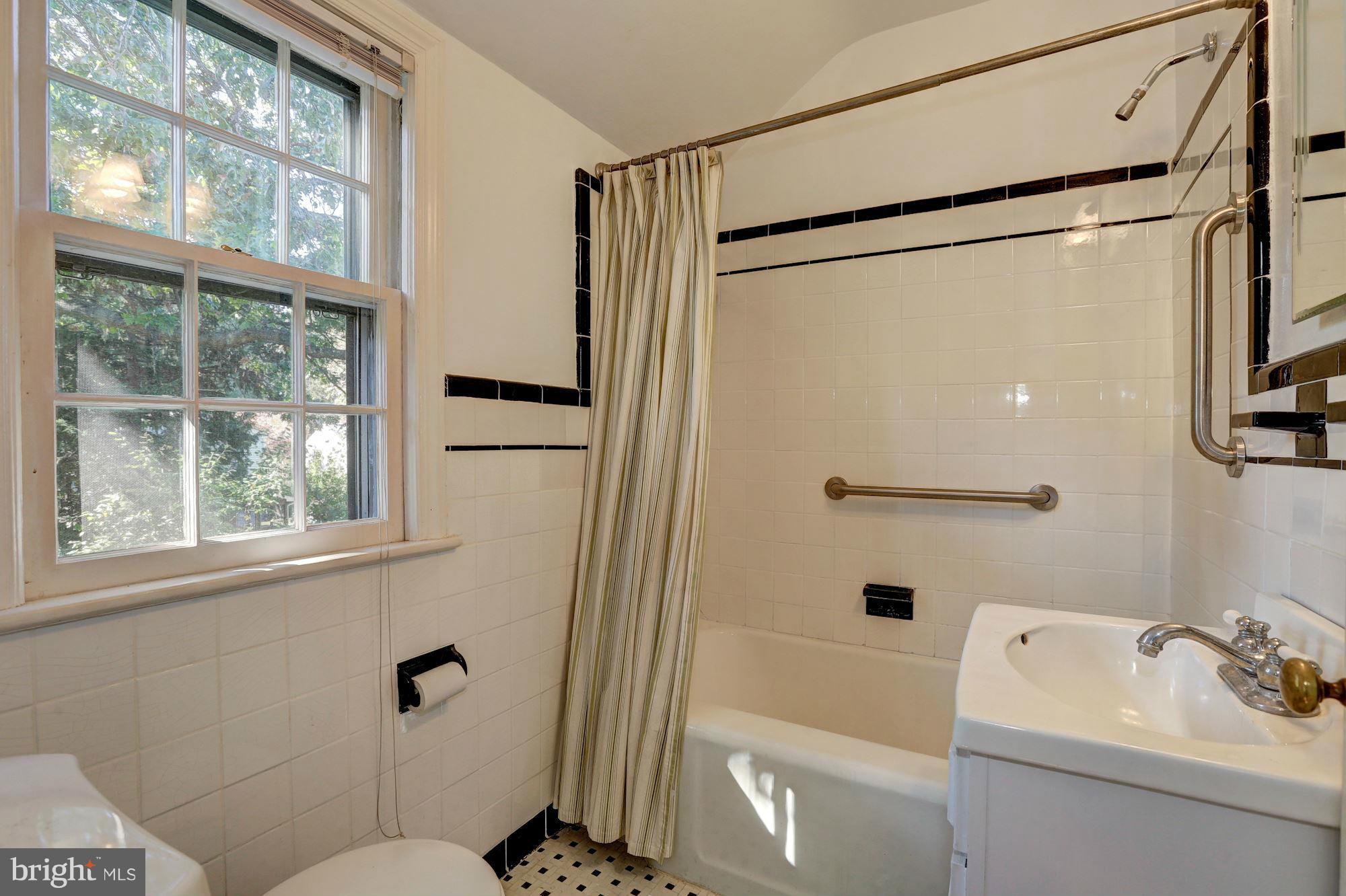 9222 Glenville Road Silver Spring, MD 20901 - Photo 19 of 30 Classic Black and White Tile Bath