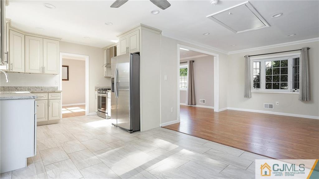 1884 Holly Road North Brunswick, NJ 08902 - Photo 14 of 39 a view of a kitchen with a sink and a refrigerator
