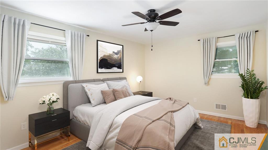 1884 Holly Road North Brunswick, NJ 08902 - Photo 19 of 39 a bedroom with a large bed and a window