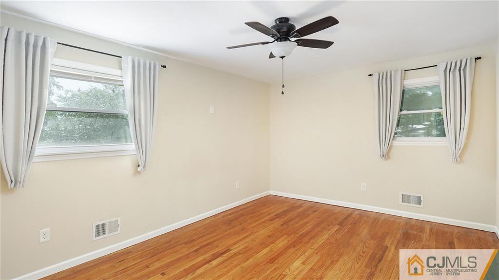 1884 Holly Road North Brunswick, NJ 08902 - Photo 20 of 39 a view of a room with wooden floor and a window