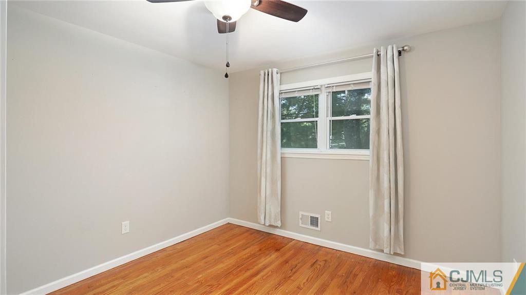 1884 Holly Road North Brunswick, NJ 08902 - Photo 26 of 39 an empty room with windows