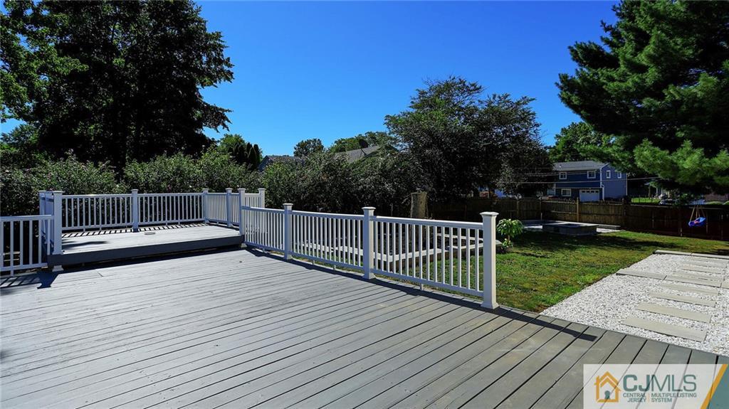 1884 Holly Road North Brunswick, NJ 08902 - Photo 30 of 39 a view of a deck with a yard
