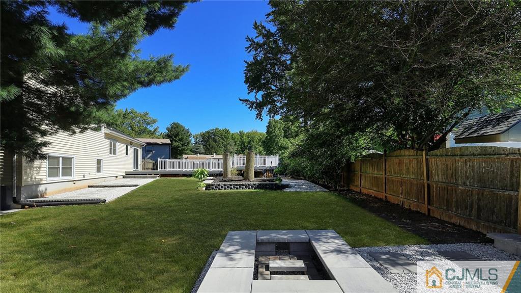1884 Holly Road North Brunswick, NJ 08902 - Photo 34 of 39 a view of house with backyard space and garden