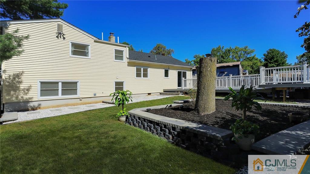 1884 Holly Road North Brunswick, NJ 08902 - Photo 37 of 39 a front view of house with yard and outdoor seating