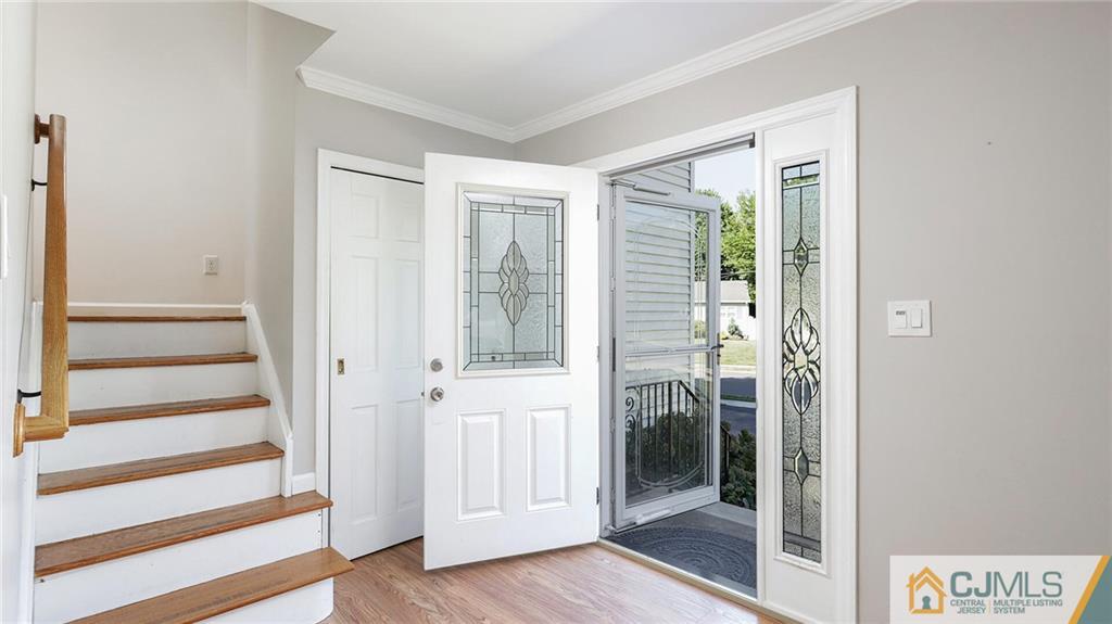 1884 Holly Road North Brunswick, NJ 08902 - Photo 5 of 39 a view of a livingroom with wooden floor and windows
