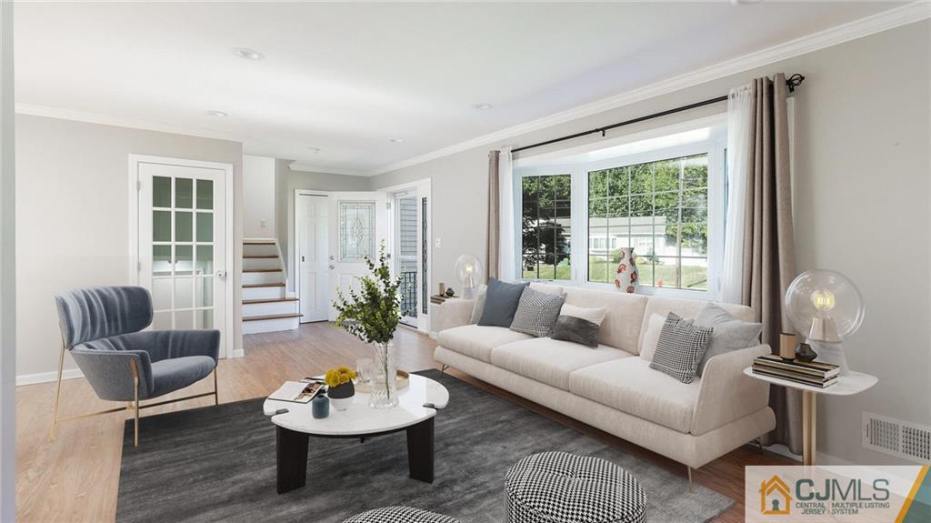 1884 Holly Road North Brunswick, NJ 08902 - Photo 6 of 39 a living room with furniture and a large window