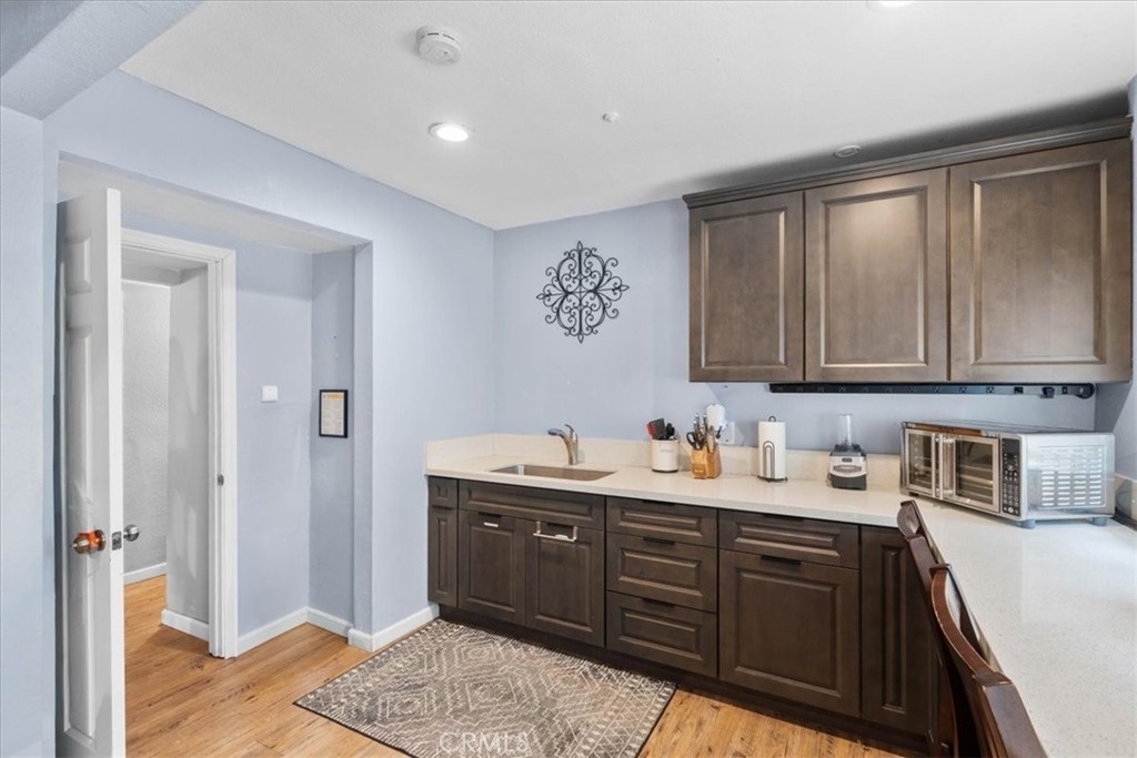 3974 5th Street Riverside, CA 92501 - Photo 17 of 45 a kitchen with a sink and cabinets