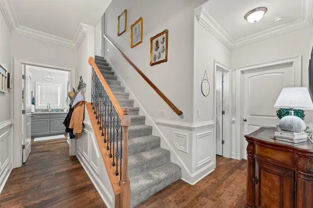 a view of entryway and hall with wooden floor