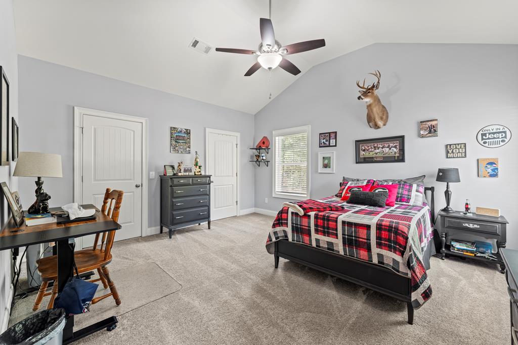 2800 Hopewell Church Road Pine Mountain, GA 31822 - Photo 31 of 38 a bedroom with a bed and a chair in it