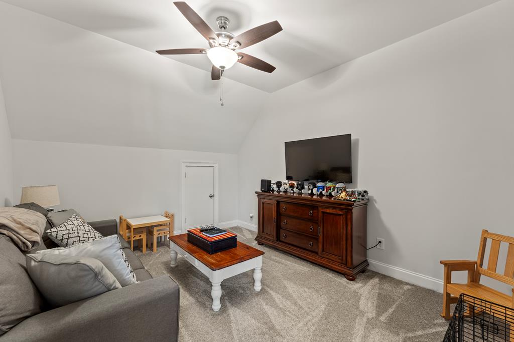 2800 Hopewell Church Road Pine Mountain, GA 31822 - Photo 32 of 38 a living room with furniture and a flat screen tv