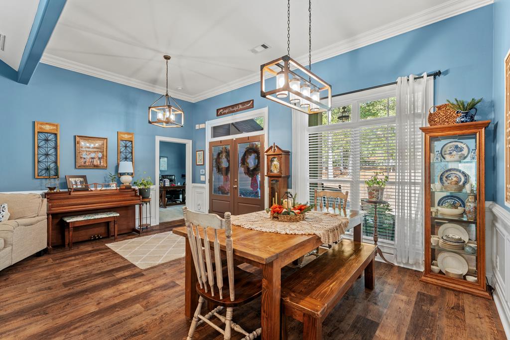 2800 Hopewell Church Road Pine Mountain, GA 31822 - Photo 9 of 38 a view of a dining room with furniture wooden floor and chandelier