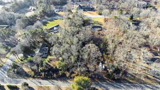 an aerial view of house with yard