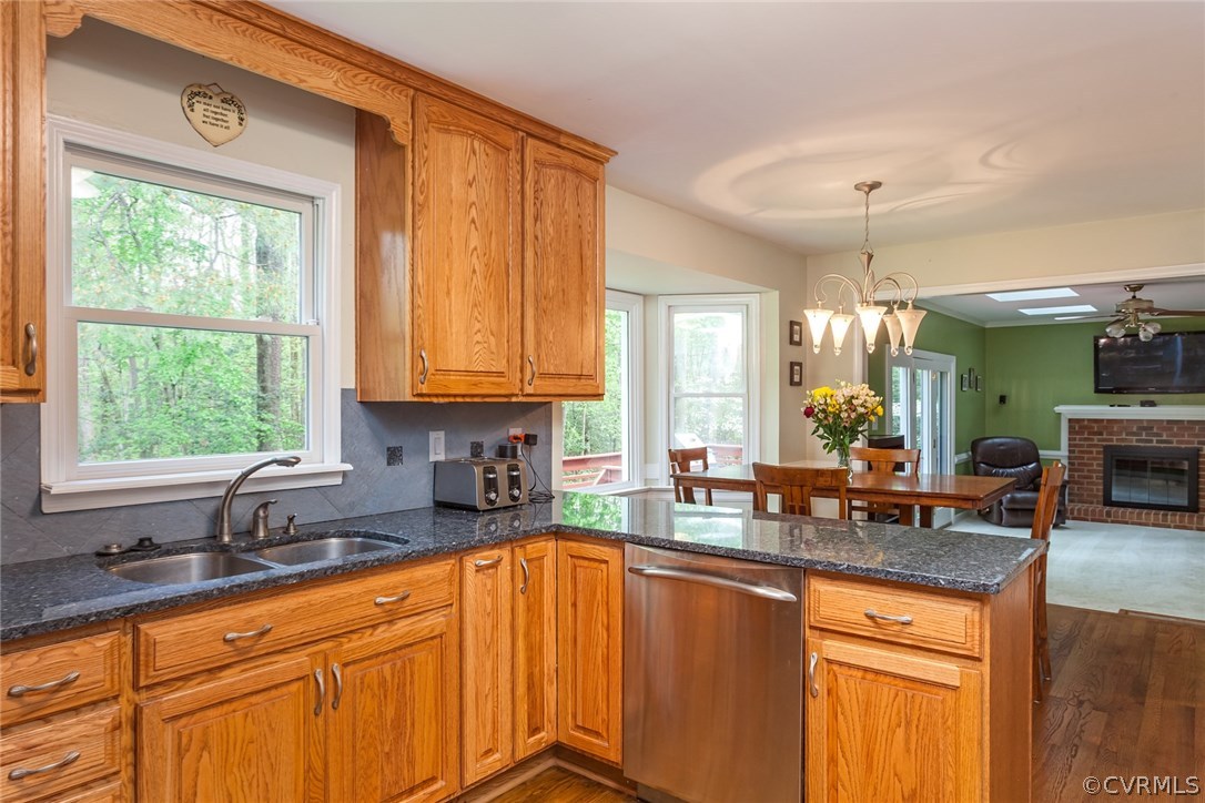 5702 Grove Forest Road Midlothian, VA 23112 - Photo 13 of 30 a kitchen with sink a window and cabinets
