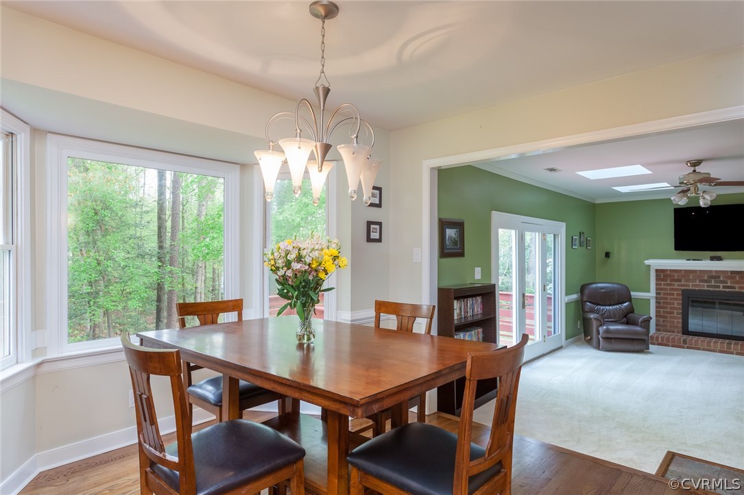 5702 Grove Forest Road Midlothian, VA 23112 - Photo 10 of 30 a view of a dining room with furniture window and outside view