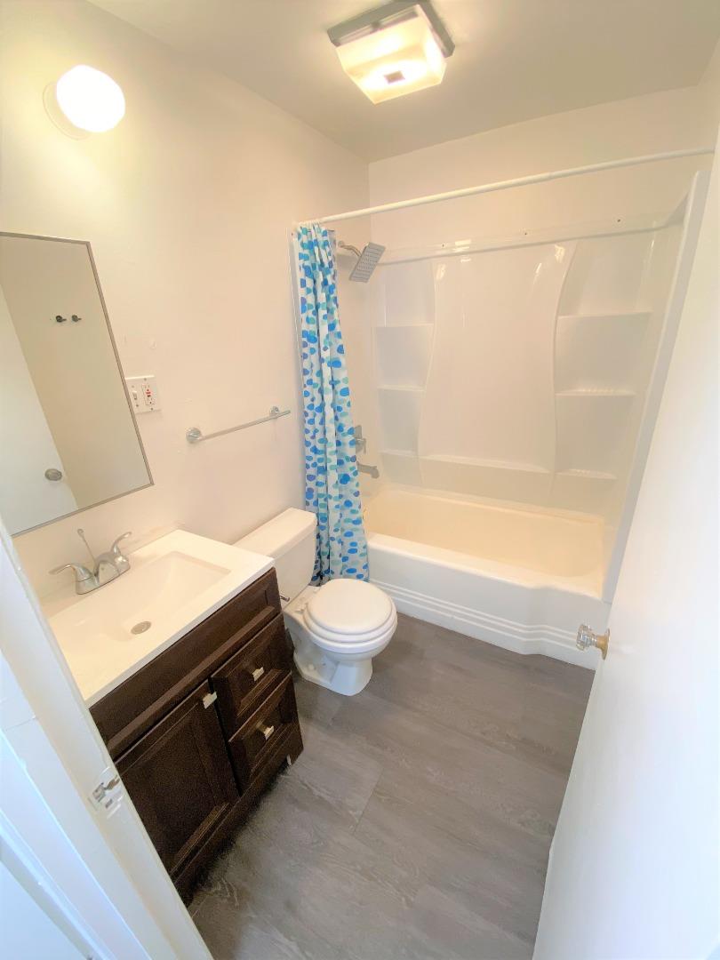 1818 63rd Street Berkeley, CA 94703 - Photo 8 of 15 a bathroom with a sink vanity granite and toilet