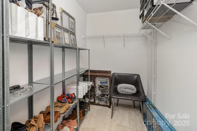 a utility room with lots of racks on the wall