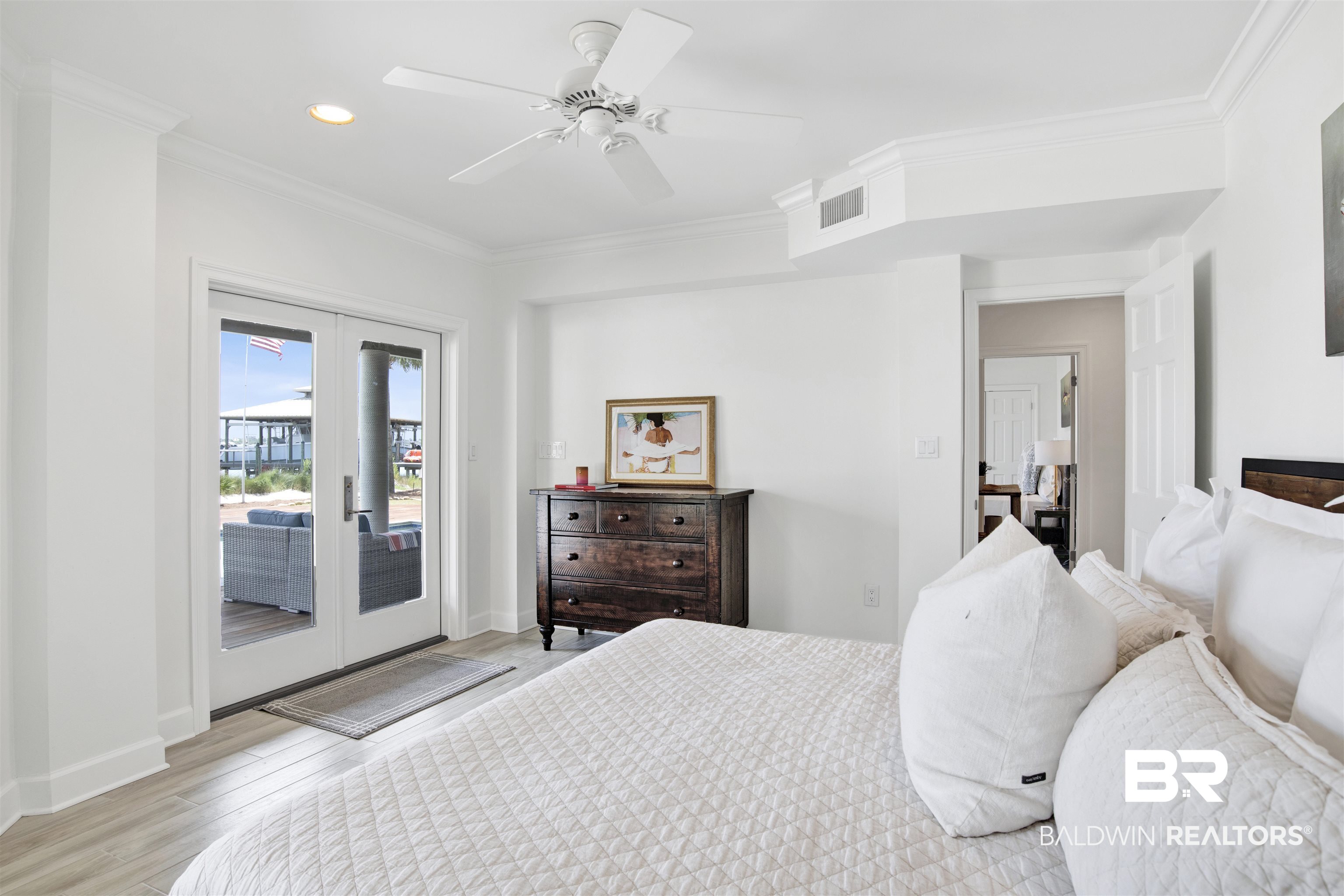 33400 River Road Orange Beach, AL 36561 - Photo 45 of 72 Bedroom featuring crown molding, french doors, light wood-type flooring, access to outside, and ceiling fan