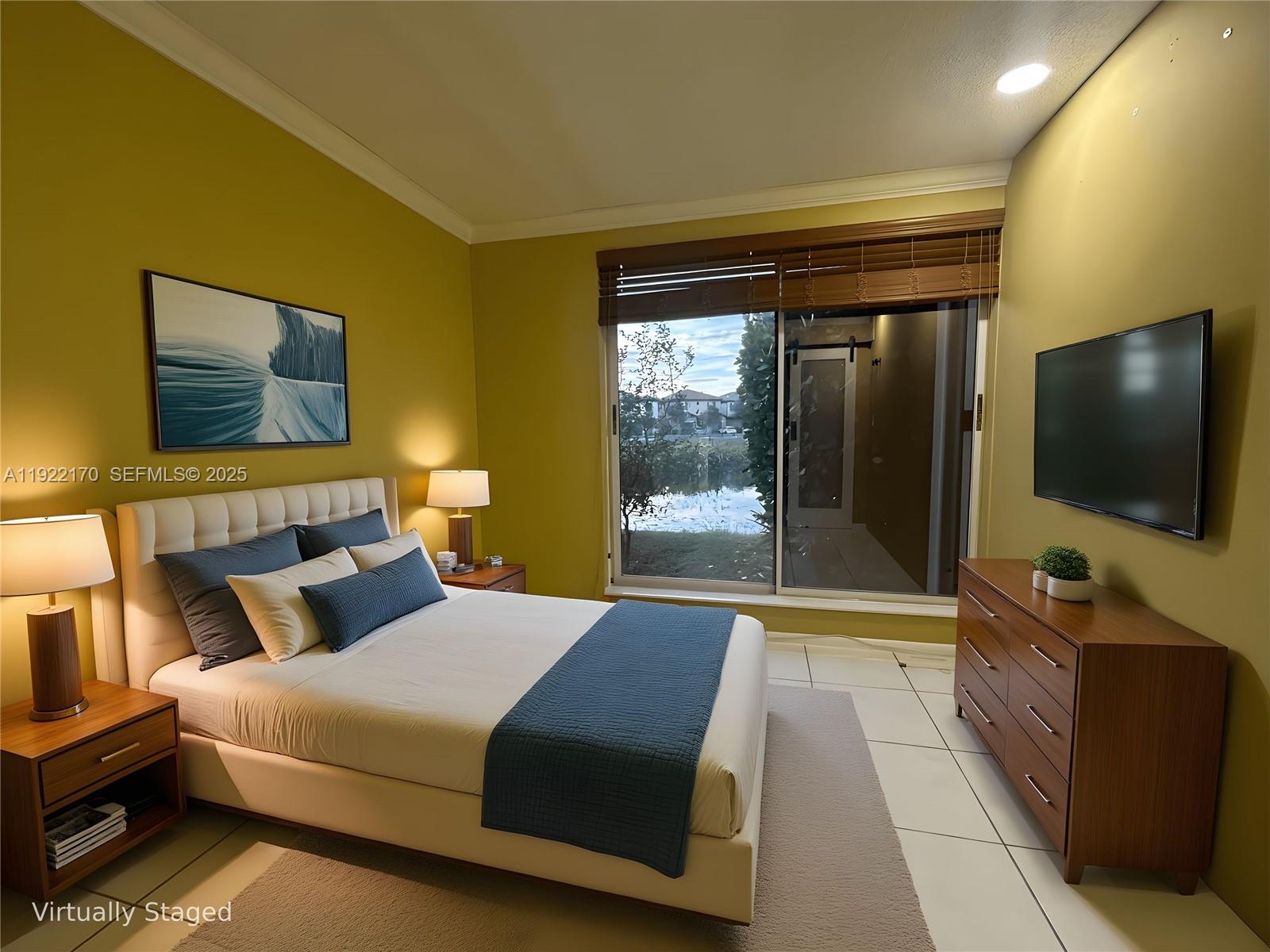 4905 Northwest 49th Road Tamarac, FL 33319 - Photo 13 of 25 a bedroom with a bed and a flat screen tv