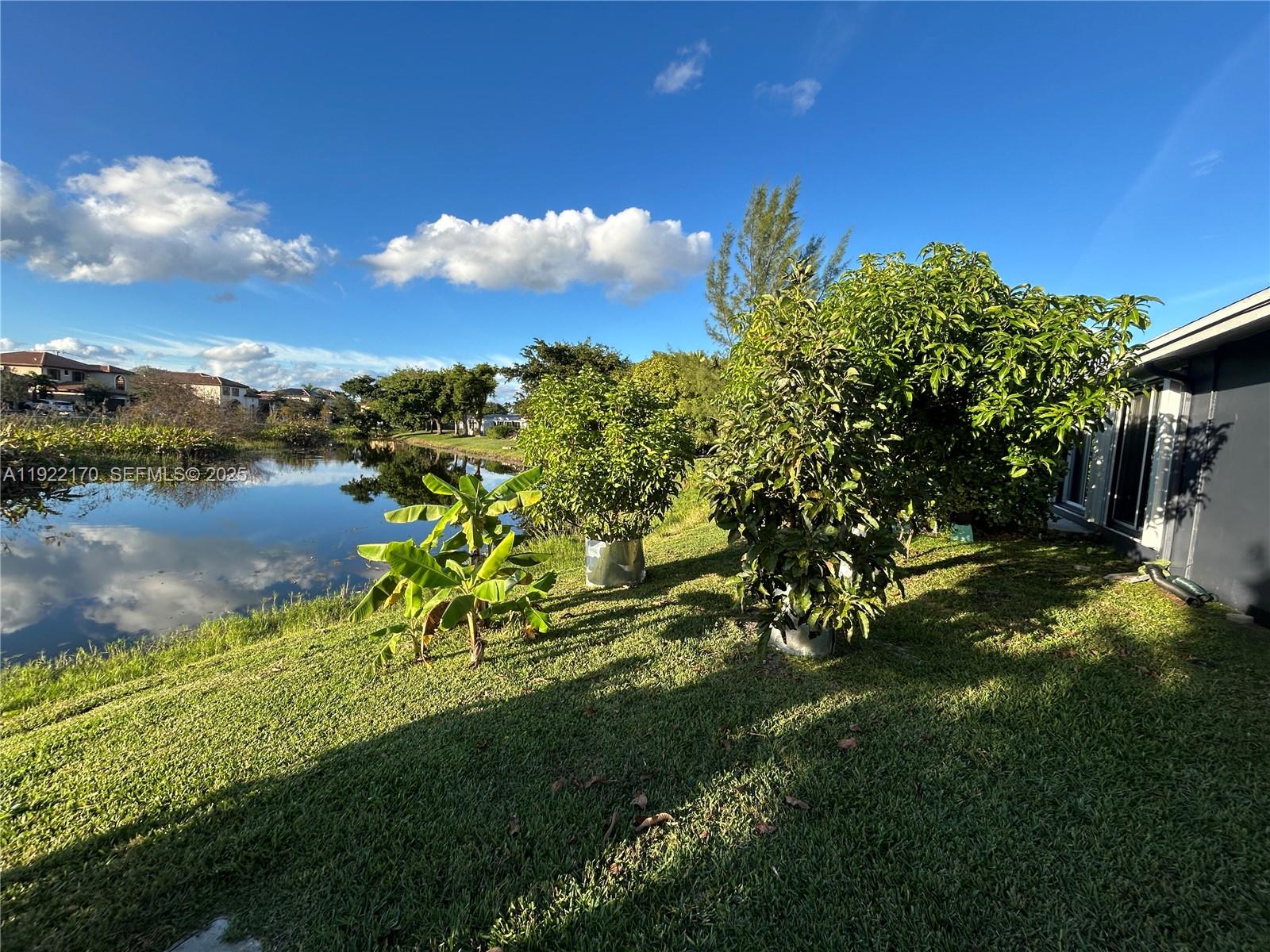 4905 Northwest 49th Road Tamarac, FL 33319 - Photo 20 of 25 a view of a lake with a yard
