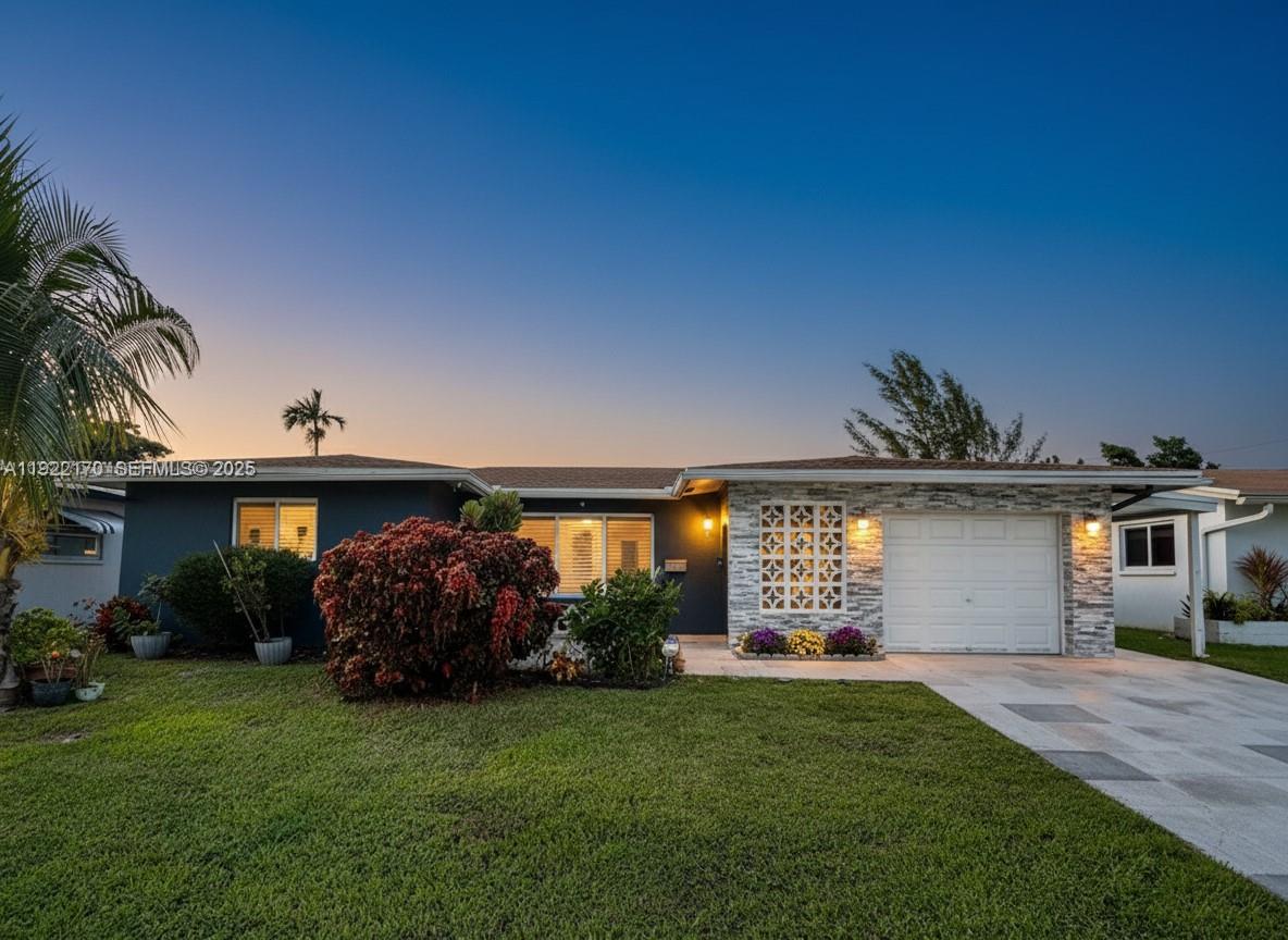 4905 Northwest 49th Road Tamarac, FL 33319 - Photo 25 of 25 a front view of house with yard and outdoor seating