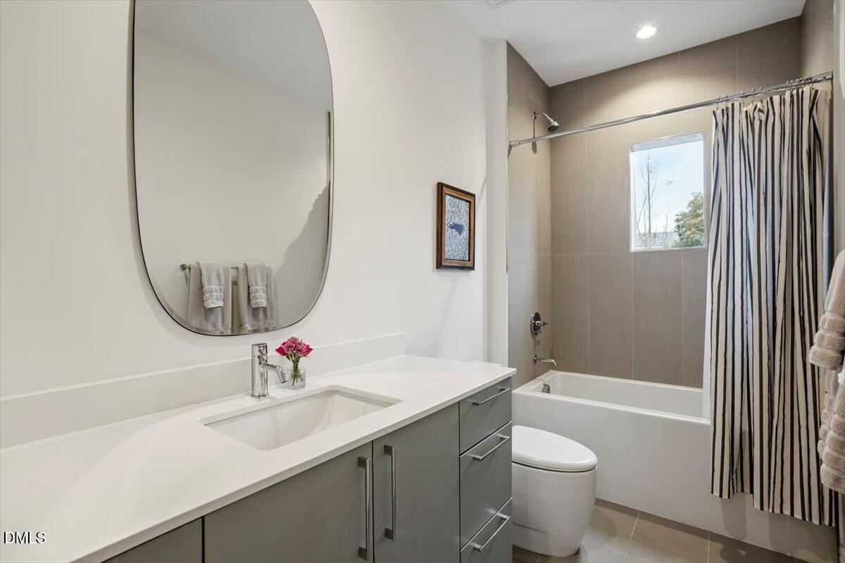 206 Dundas Lane Raleigh, NC 27603 - Photo 19 of 30 a bathroom with a sink and a mirror