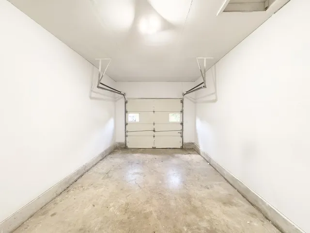 a view of a big room with closet and windows