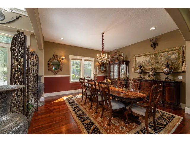 a view of a dining room with furniture and chandelier