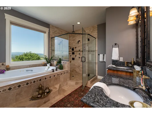 a bathroom with a tub sink and mirror