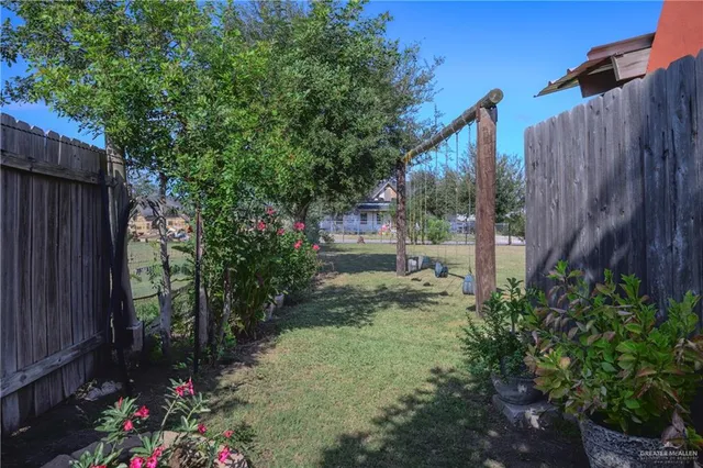 a backyard of a house with lots of green space
