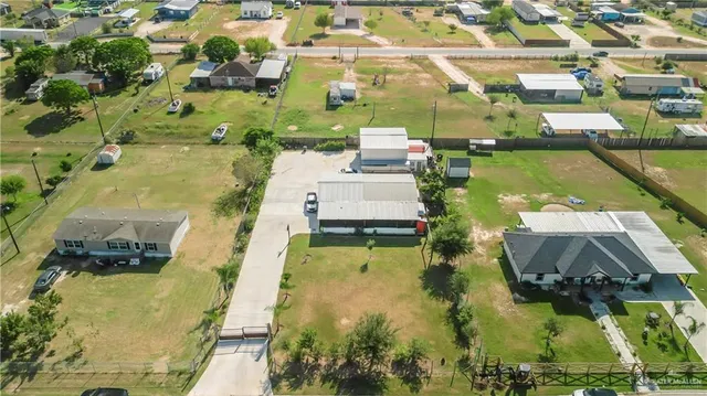 an aerial view of a house with swimming pool