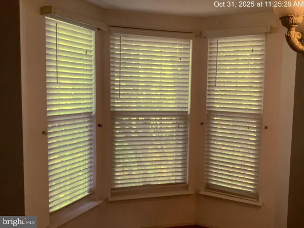 a view of a room that has a window in it