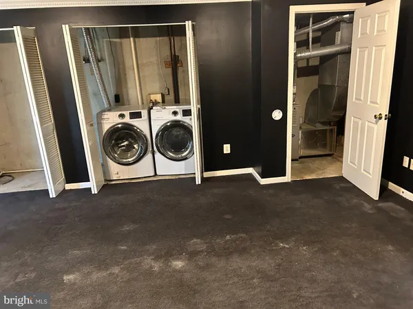 a view of a storage & utility room with washer and dryer
