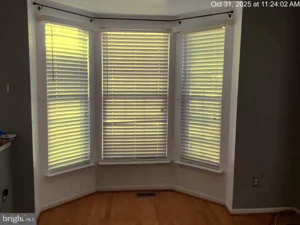 a view of a room with a large window