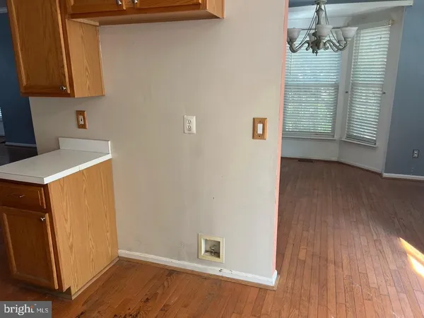 a view of a storage & utility room with a window