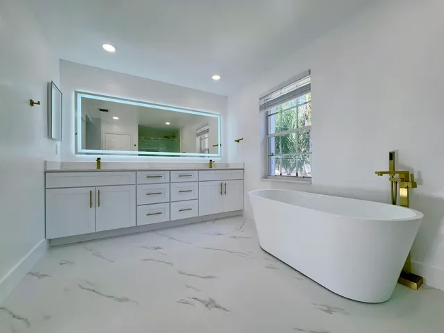 a bathroom with a sink vanity and mirror