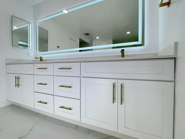 a bathroom with a bathtub and shower