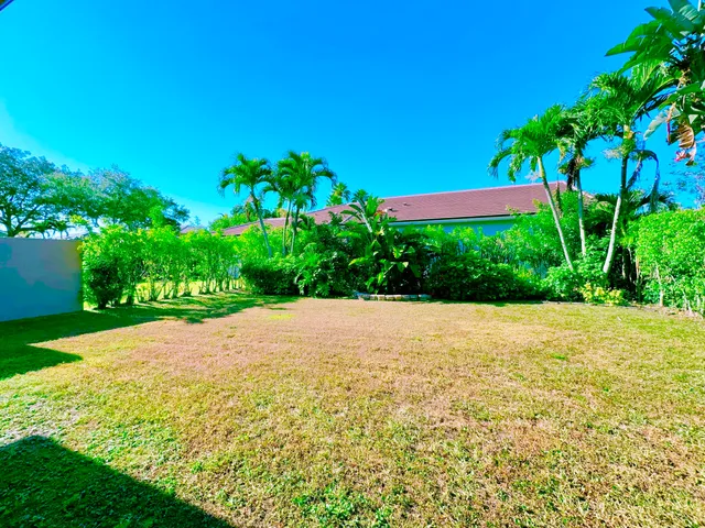 an aerial view of lake and residential houses with outdoor space