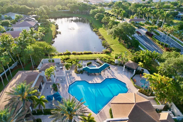 an aerial view of a house with a lake view