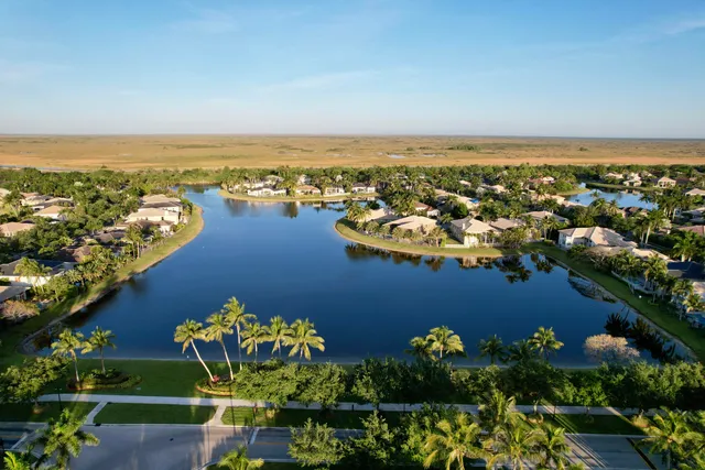 a kitchen with sink refrigerator and cabinets