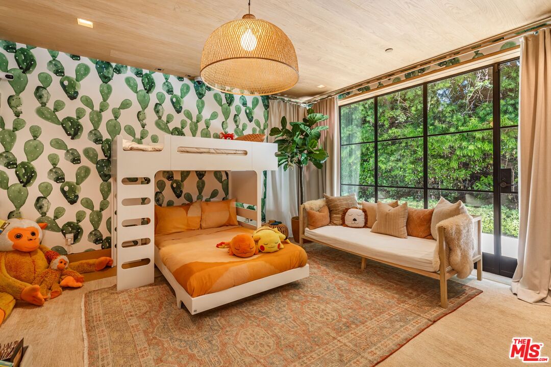 859 Woodacres Road Santa Monica, CA 90402 - Photo 31 of 54 a bedroom with a bed and a large window