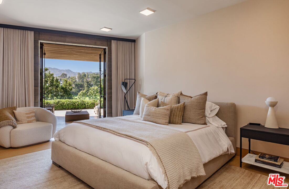 859 Woodacres Road Santa Monica, CA 90402 - Photo 32 of 54 a bedroom with bed and a couch