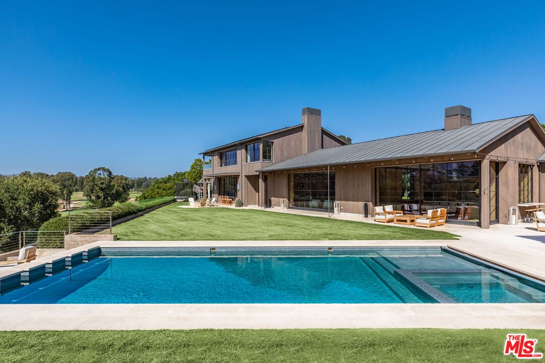 859 Woodacres Road Santa Monica, CA 90402 - Photo 51 of 54 a front view of a house with a yard