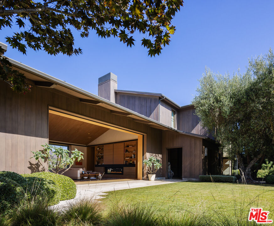 859 Woodacres Road Santa Monica, CA 90402 - Photo 9 of 54 a view of a house with a yard