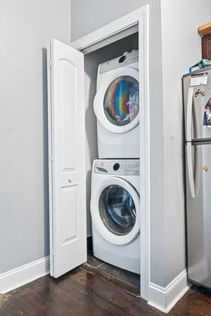 a utility room with sink dryer and washer