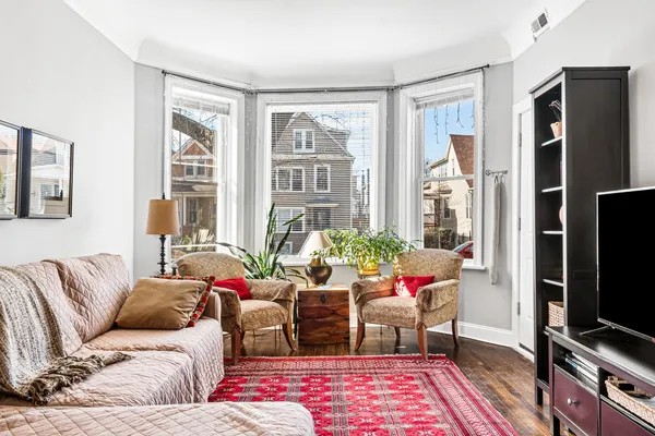a living room with furniture fireplace and flat screen tv