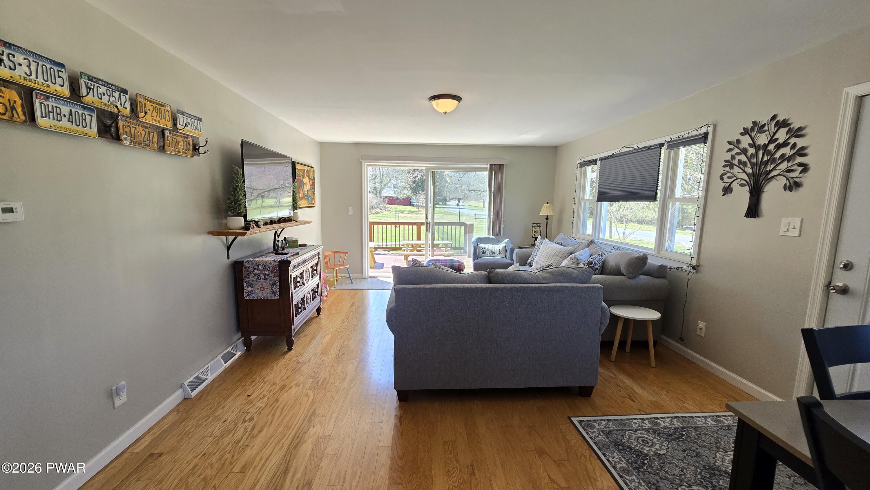 430 Griffith Road Tyler Hill, PA 18469 - Photo 10 of 31 a living room with furniture and a flat screen tv