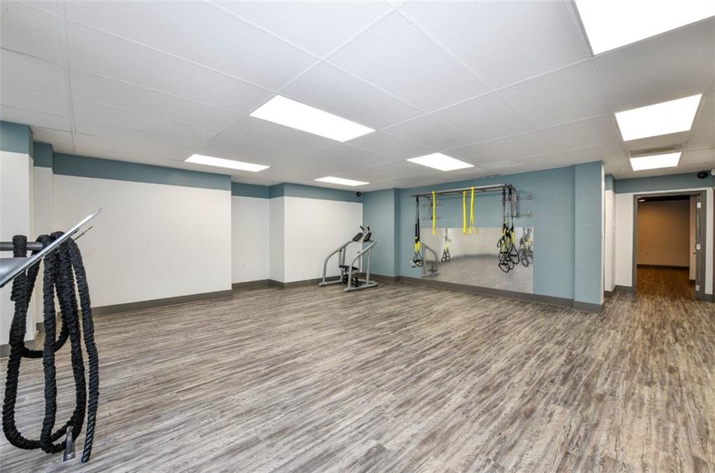 670 Thornton Road, Unit 506 Lithia Springs, GA 30122 - Photo 13 of 26 a view of a room with gym equipment and wooden floor