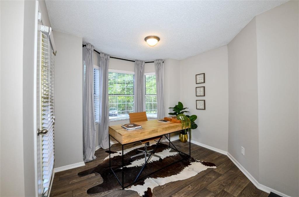 670 Thornton Road, Unit 506 Lithia Springs, GA 30122 - Photo 7 of 26 a view of a workspace with furniture and a window
