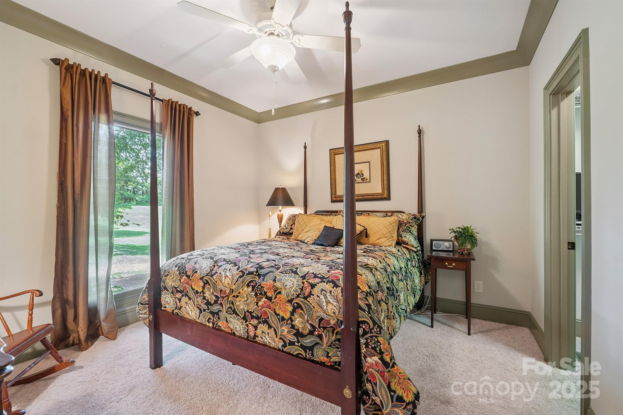 8304 Renee Ford Road Stanfield, NC 28163 - Photo 23 of 30 a bedroom with a bed and large window