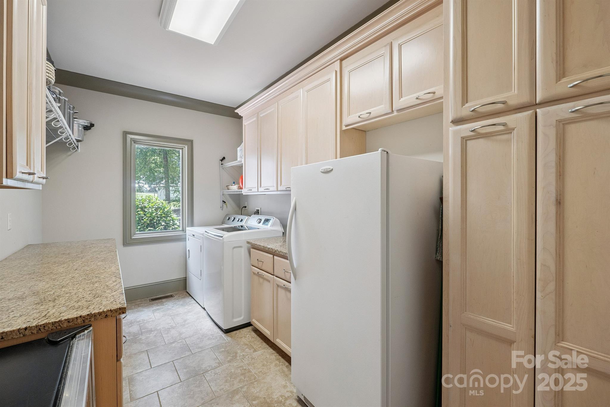 8304 Renee Ford Road Stanfield, NC 28163 - Photo 26 of 30 a utility room with cabinets washer and dryer